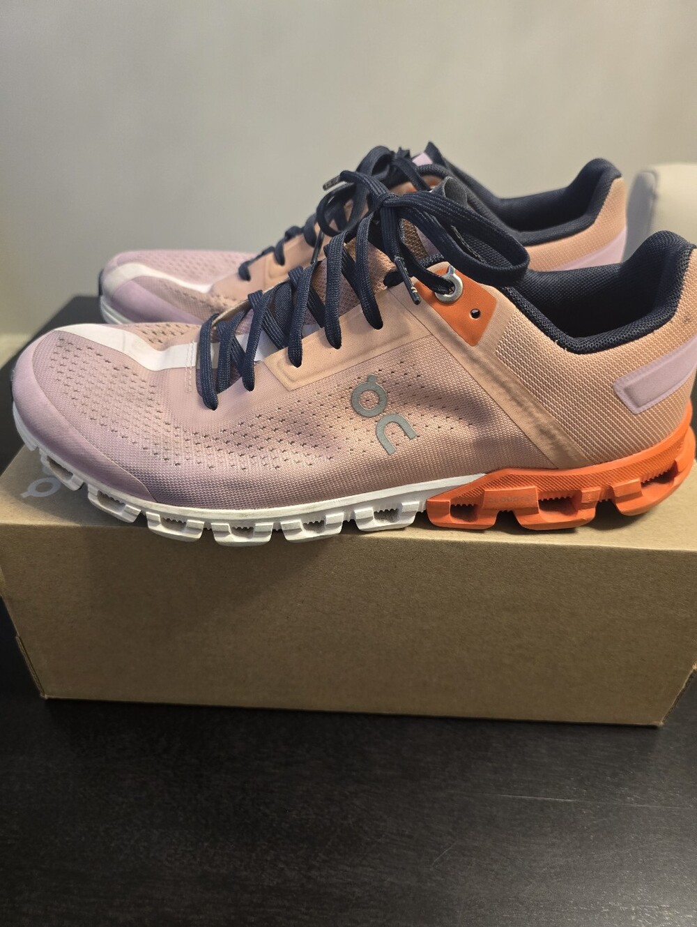On Running women's athletic shoes in pink with orange sole